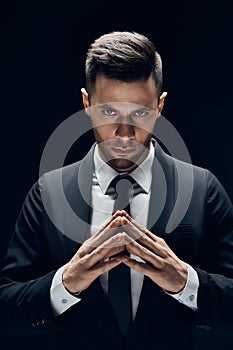 Concentrated business man make sinister plans photo