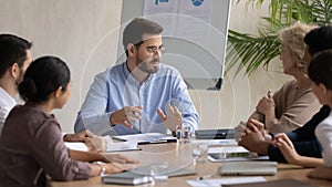 Concentrated businesspeople discuss business ideas at office meeting