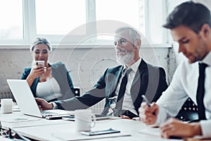 Concentrated colleagues having staff meeting