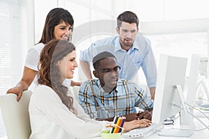 Concentrated coworkers using computer together