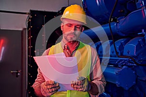 concentrated devoted technician in safety vest