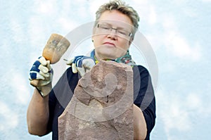 Concentrated female stonemason