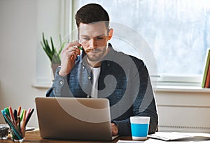 Concentrated man working on laptop