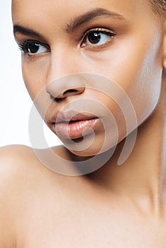 Concentrated Negroid woman posing in the studio