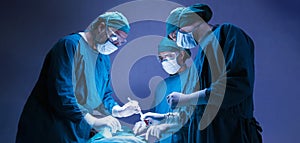 Concentrated professional surgical doctor team operating surgery a patient in the operating room at the hospital. healthcare and