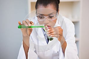 Concentrated scientist doing scientific experiment