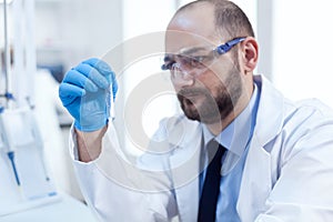 Concentrated scientist in laboraty conducting sample reseach