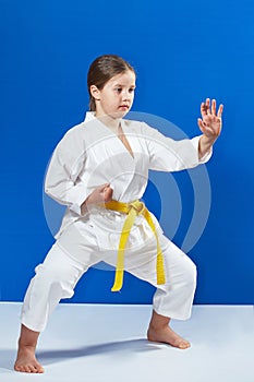 Concentrated sportswoman in a karate rack