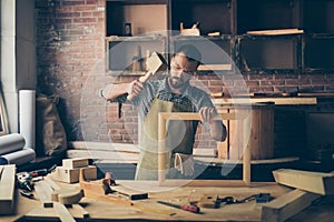 Concentrated successful knowledgeable smart bearded craftsman we