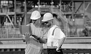 concentrated supervisor men have construction project on laptop. photo of supervisor men