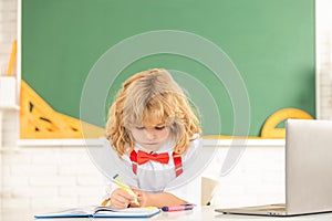 concentrated teen boy in classroom. back to school. knowledge day. concept of education.