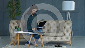 Concentrated woman calculating bills at home