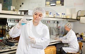 Shot of an young woman using equipment to work in a laboratory