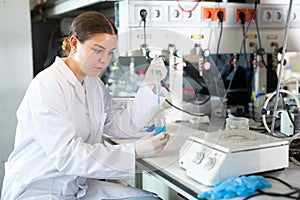 Shot of an young woman using equipment to work in a laboratory