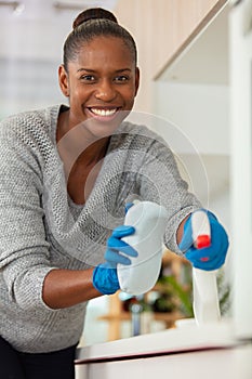 concentrated woman scrubbing bar in kitchen