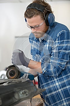 concentrated workers using grinder