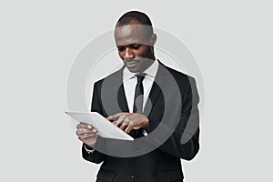 Concentrated young African man in formalwear photo