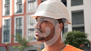 Concentrated young bearded afro american male engineer thoughtfully think work.