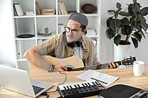 Musician playing guitar photo