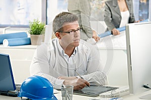 Concentrating architect at work