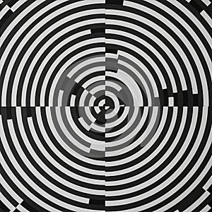 Concentric circles in black and white create a geometric pattern, divided into four