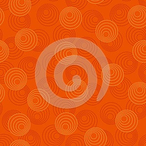 Concentric circles with dotted outline in two colors. Seamless geometric pattern on dark orange background. Vector image