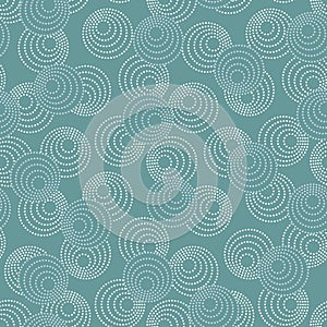 Concentric circles with dotted outline in two colors. Seamless geometric pattern on gray-blue background. Vector image