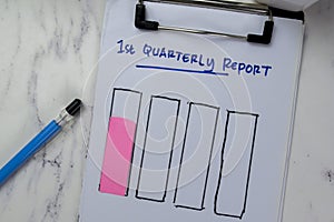 Concept of 1st Quarterly Report write on paperwork and bar graph isolated on Wooden Table