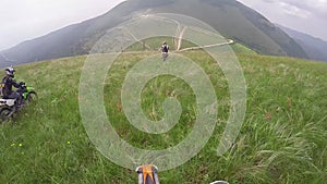 The concept of active recreation. Off-road motorbike climbs the steep slope.