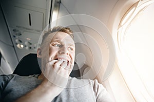 Concept aerophobia. Afraid of fear flying on an airplane and at height