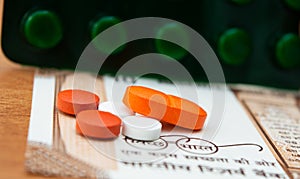 Concept of the affordable medicine in India due to generic drugs on Indian currency notes as background.