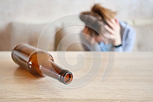 The concept of alcoholism girl is suffering from a hangover