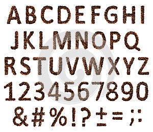 Concept of alphabet, numbers and signs laid out of roasted aromatic coffee beans isolated on a white background.