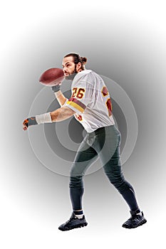 Concept american football, american football player with ball in hand. Black white background, copy space. American