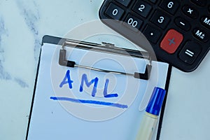 Concept of AML write on paperwork isolated on Wooden Table