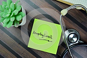 Concept of Anaphylaxis write on sticky notes isolated on Wooden Table