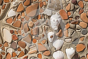 Concept of ancient culture Close up photo of broken colored stones and seashell with mosaic background .Pattern of