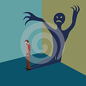 Concept of anxiety disorders, mental illness, stress and depression. A man with inner fear stands with his head down and a shadow