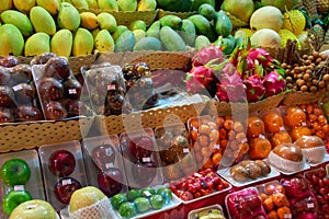 Concept asian food market street night vendor of fruits. Exotic tropical fruits.