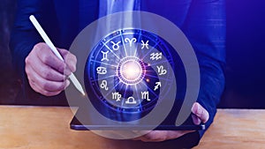 Concept of astrology and horoscope, person inside a zodiac sign wheel, Astrological zodiac signs inside of horoscope circle,