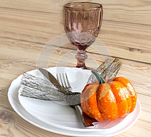 The concept of the autumn holidays. Traditional table setting for Halloween and Thanksgiving. Place for text.