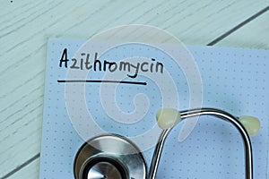 Concept of Azithromycin write on book with stethoscope isolated on Wooden Table