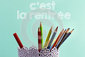 Concept back to school translated in french with Coloured pencils.