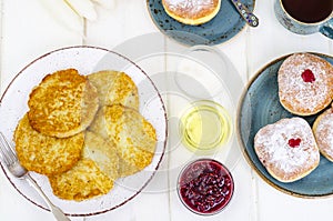 Concept and background Jewish holiday Hanukkah. Traditional food doughnuts and potatoes pancakes latkes. Flat lay or top