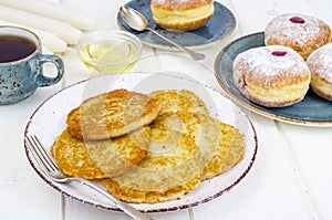 Concept and background Jewish holiday Hanukkah. Traditional food doughnuts and potatoes pancakes latkes. Flat lay or top