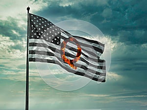 Concept background QAnon or Q Anon deep state conspiracy theory waving usa flag against dramatic sky