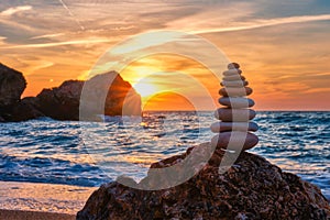 Concept of balance and harmony - stone stack on the beach