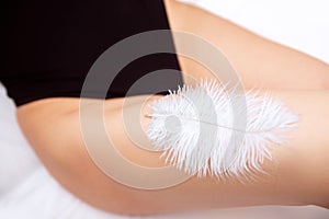 Concept banner hair laser removal and sugar epilation care. Closeup of woman legs with beautiful smooth skin with white