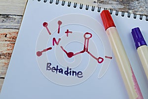 Concept of Betadine write on book isolated on Wooden Table