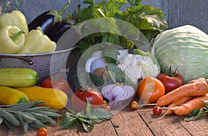 Concept bio organic food. Ingredients for healthy cooking. Vegetables and herbs on wooden background. Preparation of dishes from a